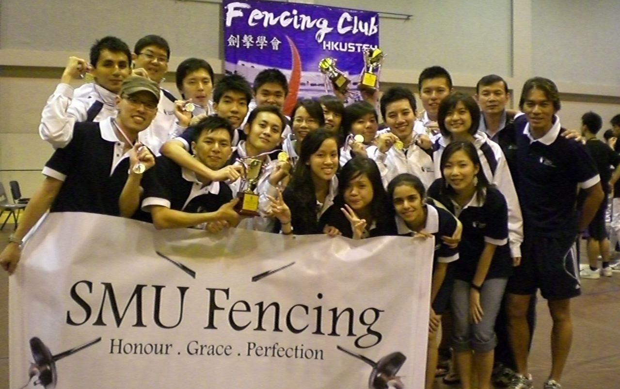 The SMU Fencing team with their medals and trophy at the HKUST Fencing Club